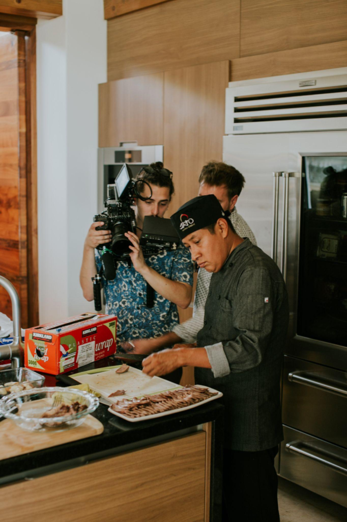 Filming a chef slicing meat