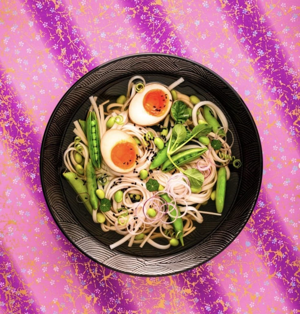 A contrasting backdrop used in a photo of a bowl of noodles, featured on Nancy Anne Harbord’s Instagram page.